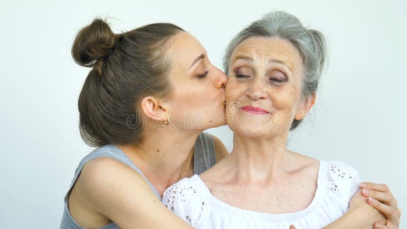 Happy Senior Mother Is Hugging Her Adult Daughter The Women Are Laughing Together Sincere