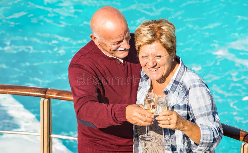 Happy senior retired couple having fun outdoors at travel vacation