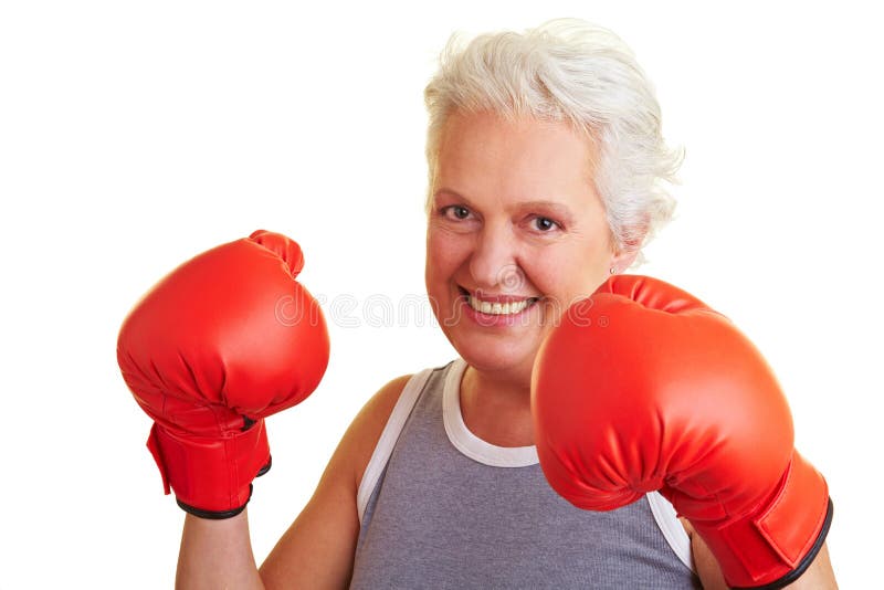 Happy senior woman boxing