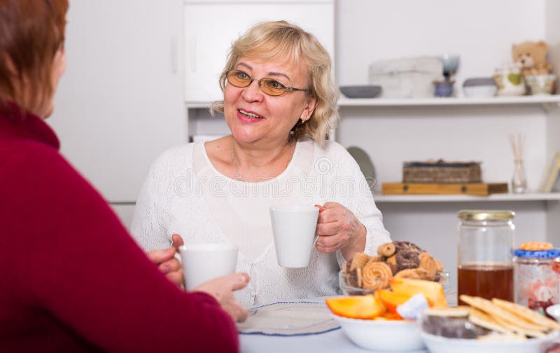 Happy Senior Woman with Female Friend Over Cup of Coffee Stock Image ...