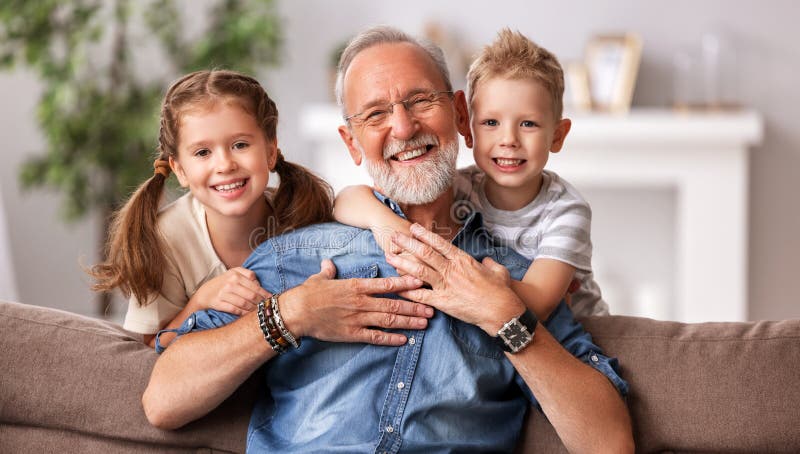 Happy senior woman hug grandkids