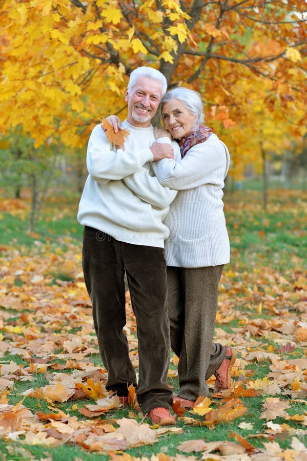 Happy senior woman and man in park stock images Happy senior woman and man in park stock images