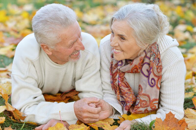 Happy senior woman and man in park royalty free stock photos Happy senior woman and man in park royalty free stock photos
