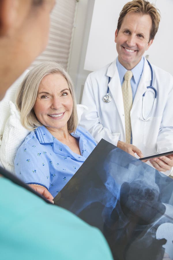 Happy Senior Woman Patient In Hospital Bed Stock Photo