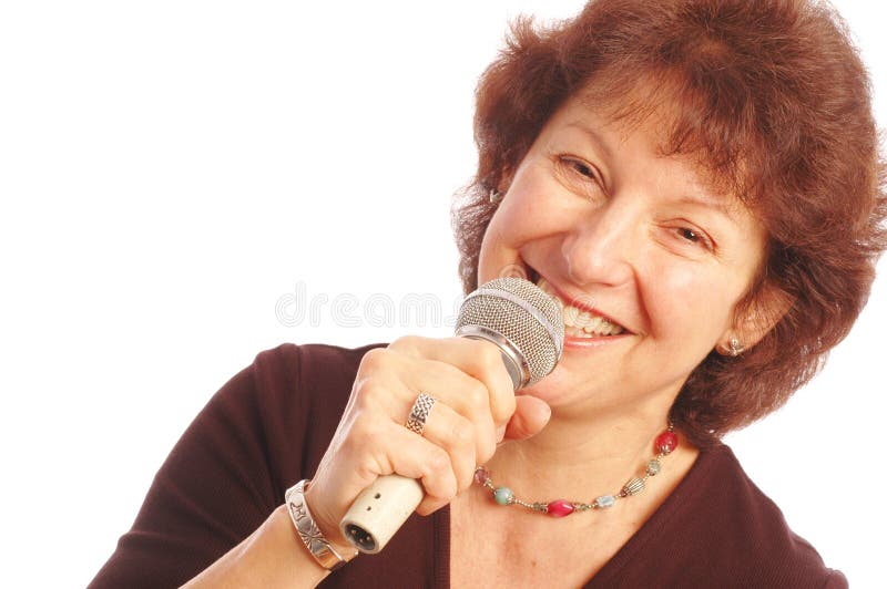 Happy senior woman singing Microphone in hand