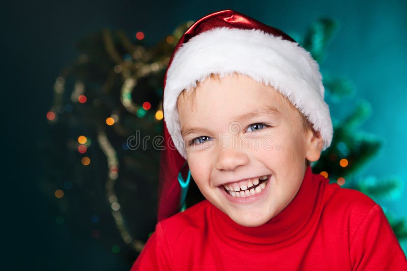 Happy small boy in santa hat