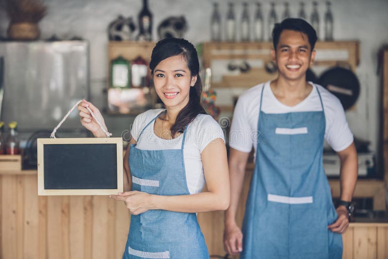 Happy small business owner ready to open her cafe