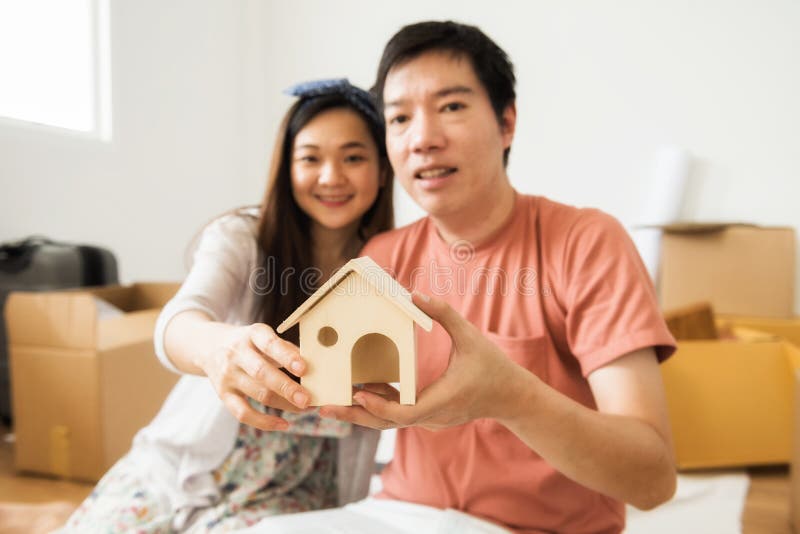 Happy couple hold Mock up home model royalty free stock image Happy couple hold Mock up home model royalty free stock image