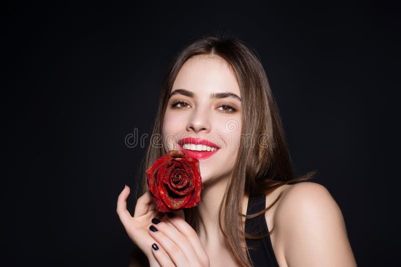 Handsome little boy with a red rose behind his back Stock Photo - Alamy