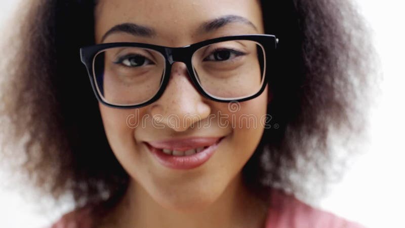 Happy smiling african american young woman face