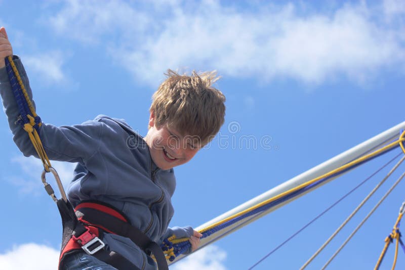 Boy Bungee Jumping on a Trampoline Stock Photo Image of bouncing, jump 112357086