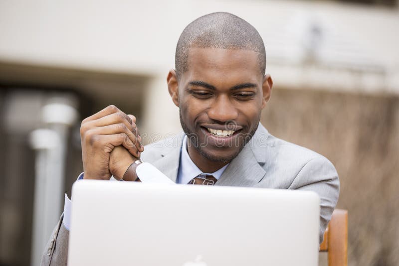 Happy smiling business man with laptop stock photos