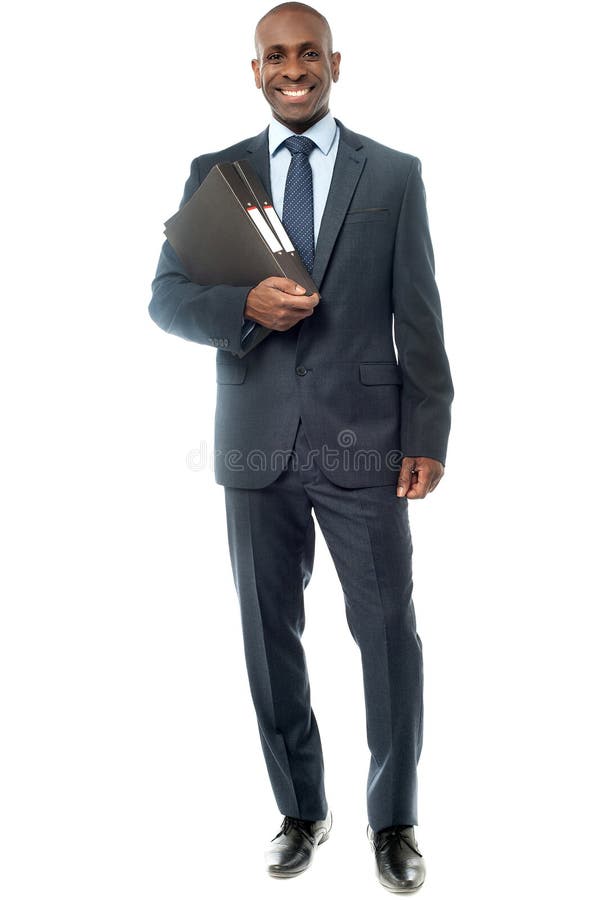 African businessman holding a fascicule with documents. African businessman holding a fascicule with documents