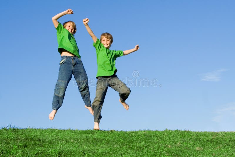 Happy smiling children jumping