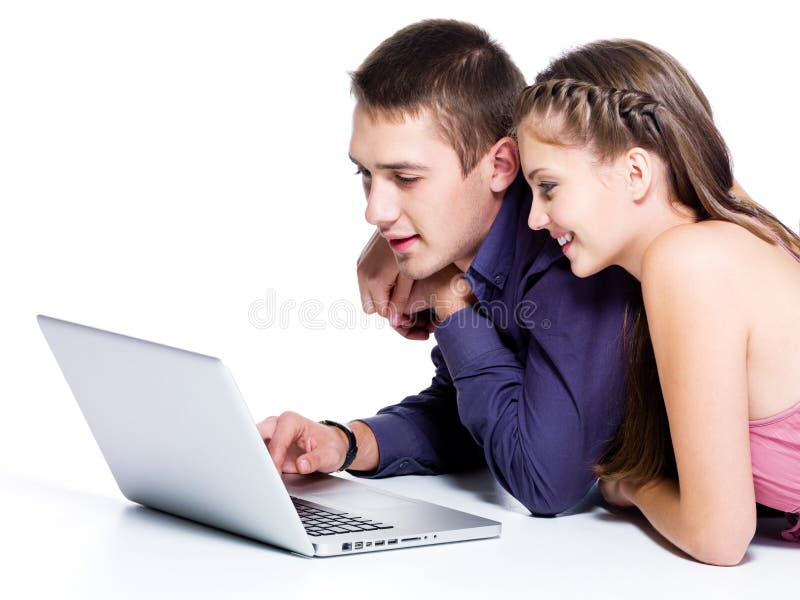 Happy smiling couple looking at laptop