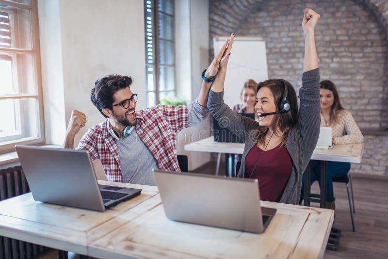 Happy smiling customer support phone operator at wor stock images