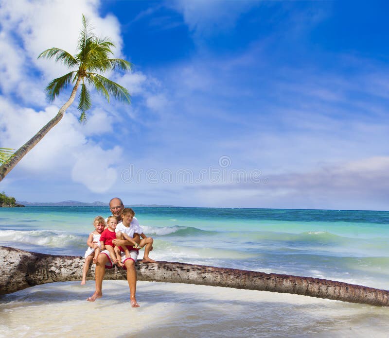 Happy smiling family on tropical beach and royalty free stock photo Happy smiling family on tropical beach and royalty free stock photo