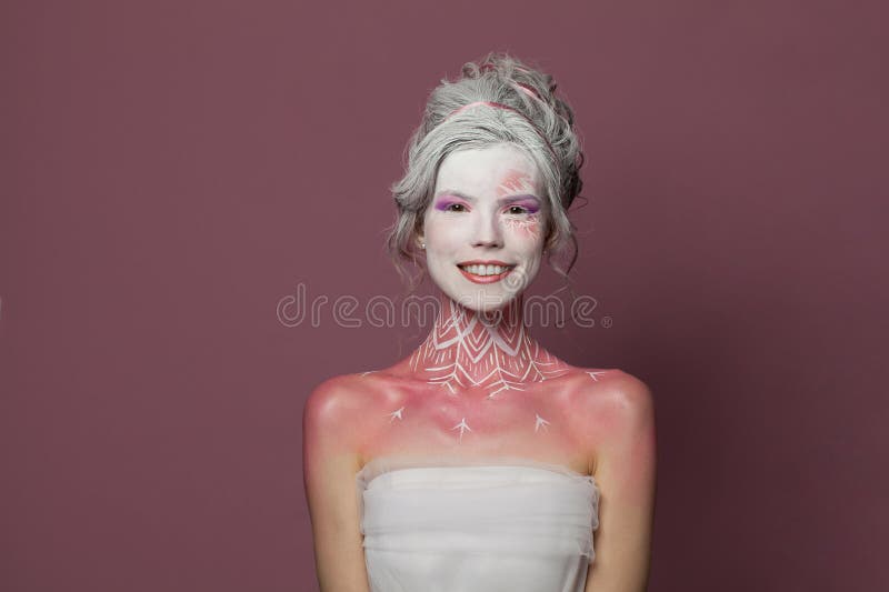 Happy smiling fashion model woman with magic makeup. Carnival or Halloween party concept