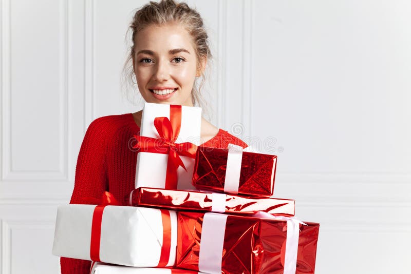 Beautiful woman with christmas gifts