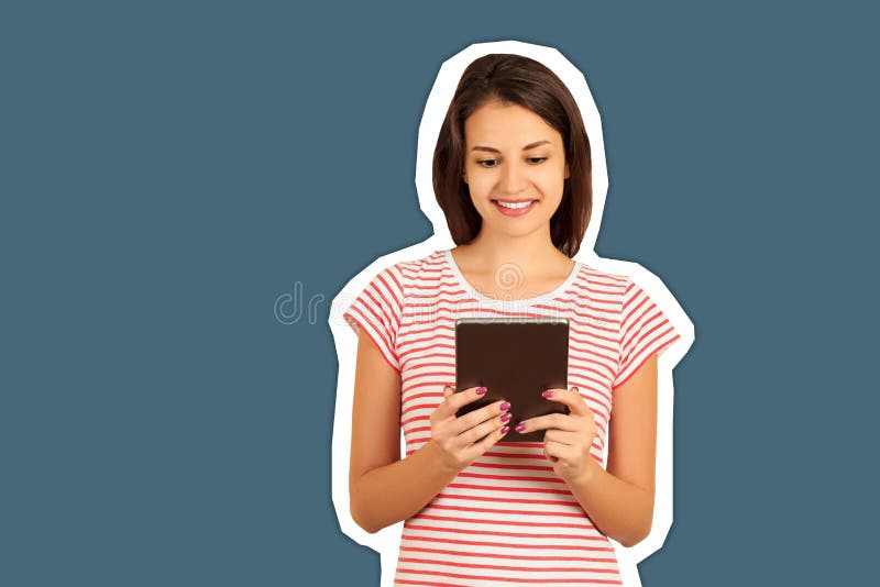 Happy smiling girl in red shirt using tablet. Smiling woman with tablet pc. emotional girl Magazine collage style with trendy stock photo Happy smiling girl in red shirt using tablet. Smiling woman with tablet pc. emotional girl Magazine collage style with trendy stock photo