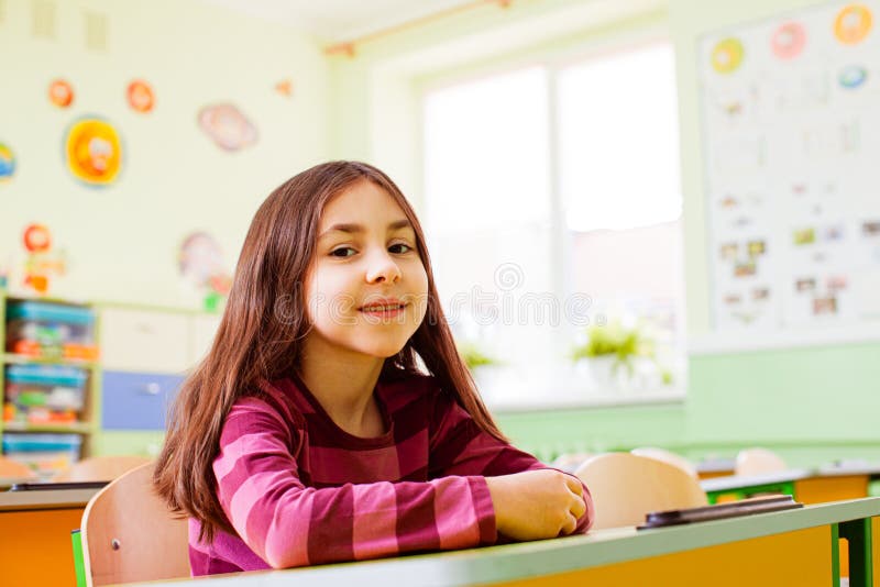 Happy smiling girl sitting in her class stock photos Happy smiling girl sitting in her class stock photos