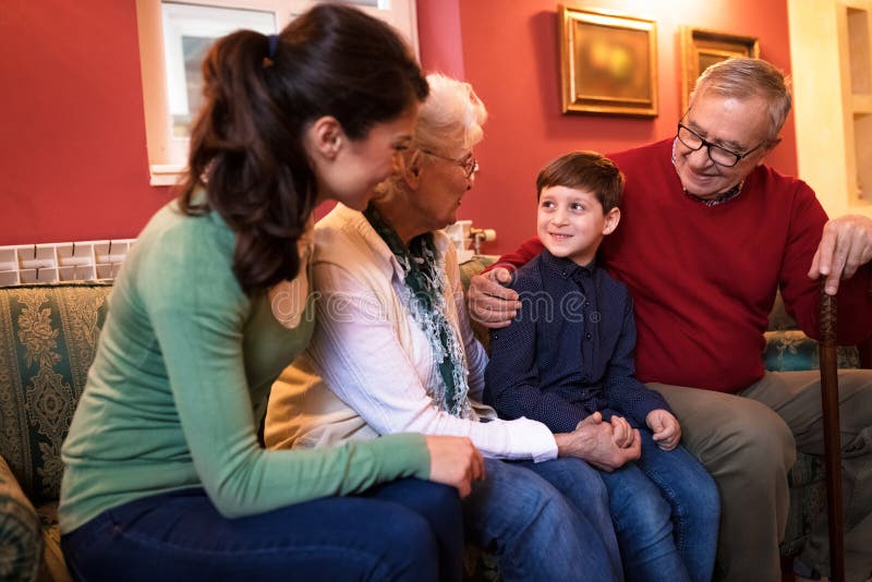 Happy smiling grandparents with their grandson stock photography Happy smiling grandparents with their grandson stock photography