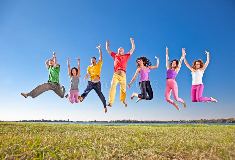 Happy smiling group of jumping people