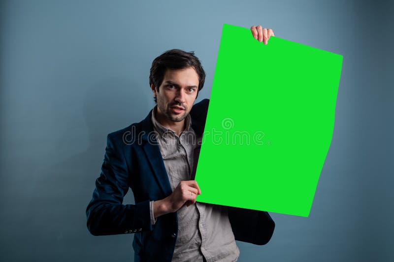 Happy smiling man showing blank signboard with empty copyspace area for slogan or advertising text message royalty free stock photos