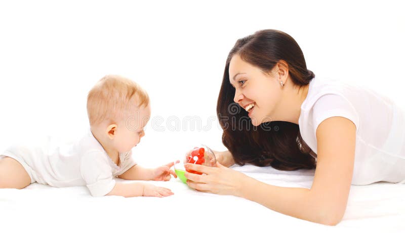Happy smiling mother and baby playing in toys over white stock photo
