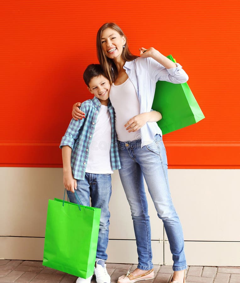 Happy Smiling Mother and Son Child with Shopping Bags Having Fun Stock ...