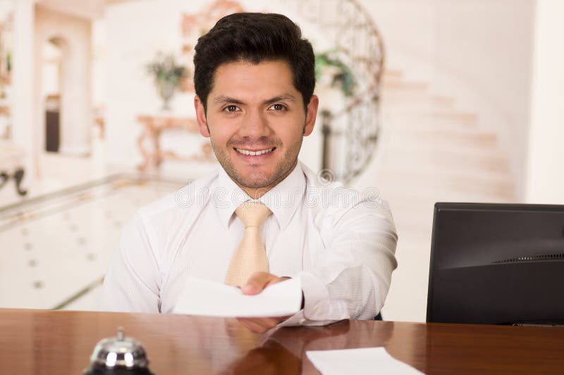 Happy Smiling Receptionist in Hotel Looking Friendly for the Guests