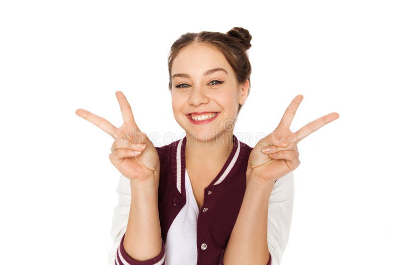Happy smiling teenage girl showing peace sign stock photography Happy smiling teenage girl showing peace sign stock photography
