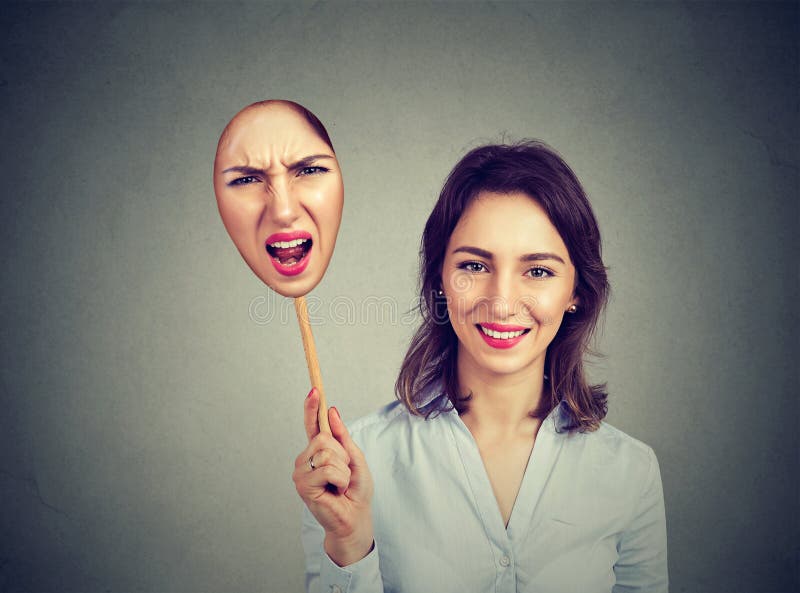 Happy woman taking off an angry mask of herself stock photography Happy woman taking off an angry mask of herself stock photography
