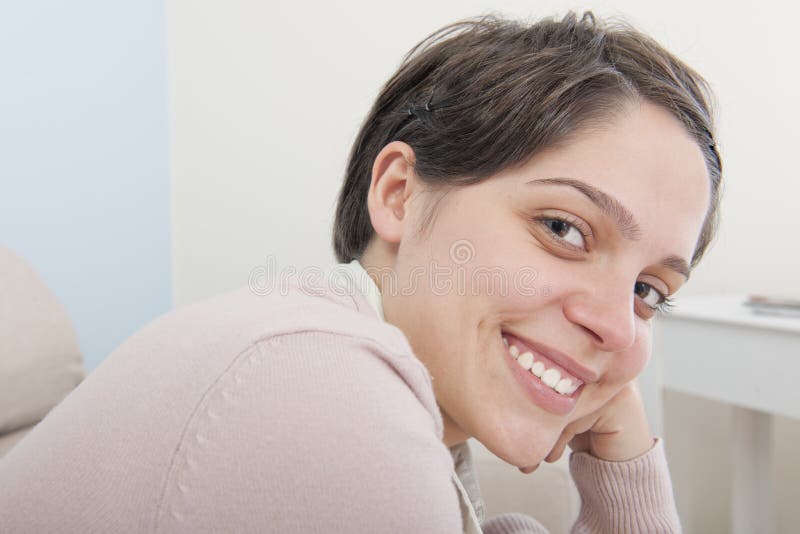 Happy smiling young adult latina woman