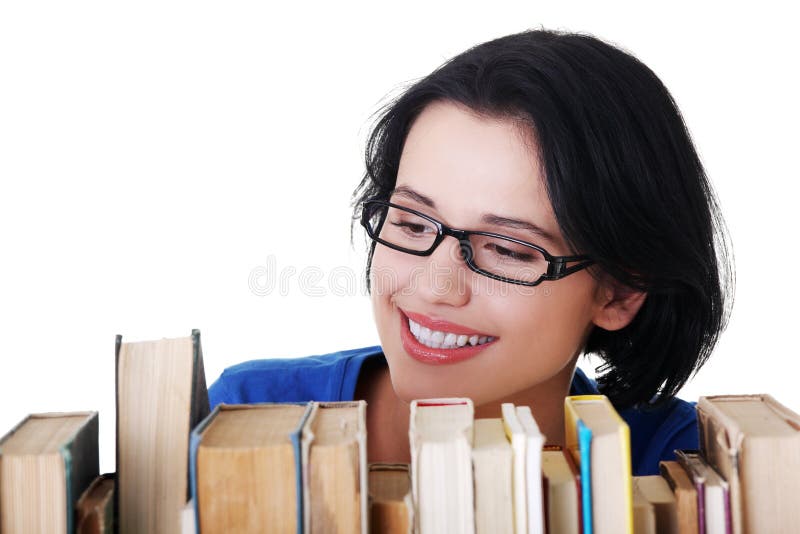 Happy smiling young student woman with books