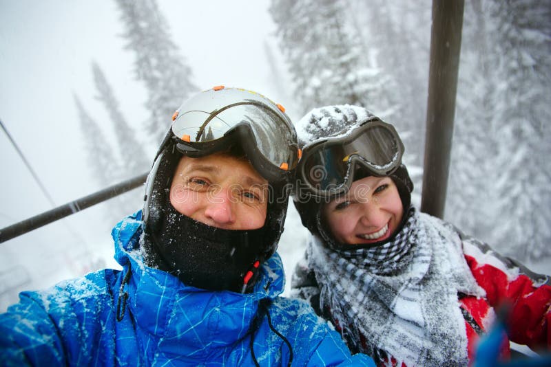 Happy snowboarders stock photo