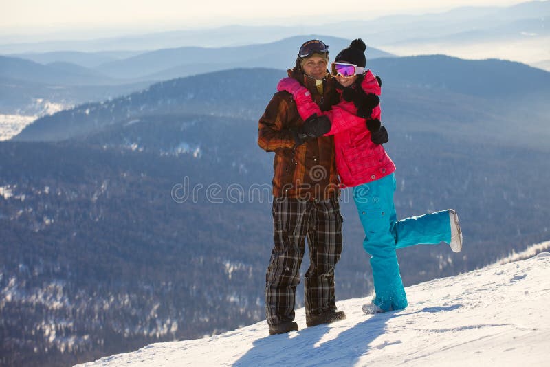 Happy snowboarding couple royalty free stock image