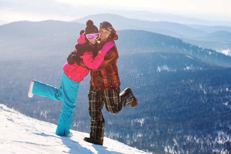 Happy snowboarding couple royalty free stock image