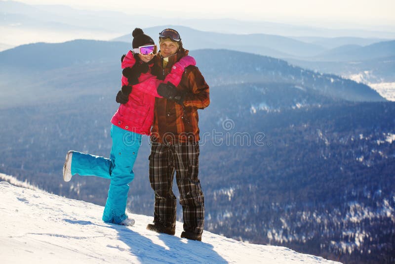 Happy snowboarding couple stock images