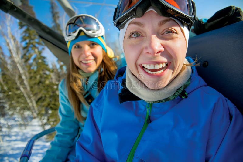 Happy snowboarding girls stock photography