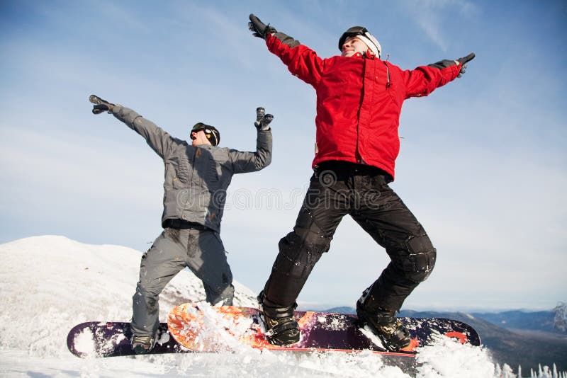 Happy snowboarding team stock image