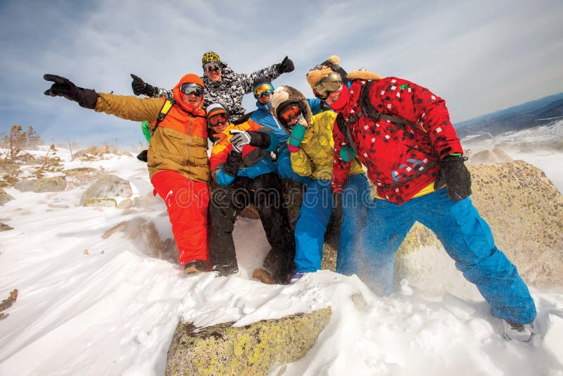Happy snowboarding team stock images