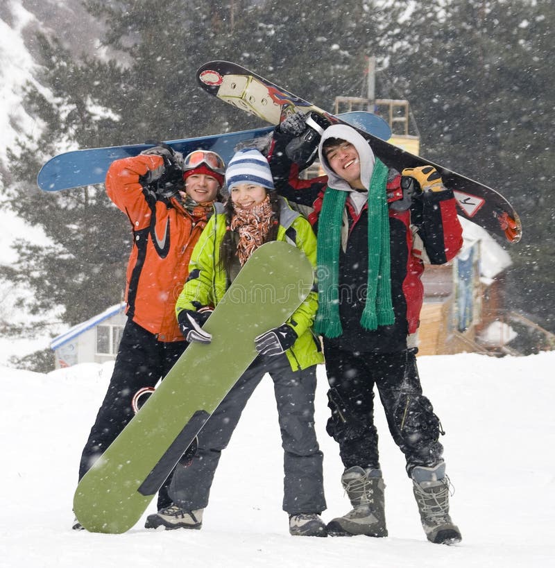 Happy snowboarding team, health lifestyle royalty free stock image