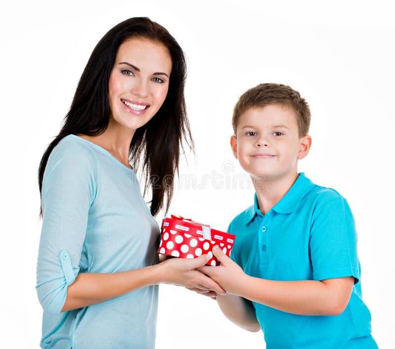 Premium Photo  Boy is very surprised by gift. mom gives gift to