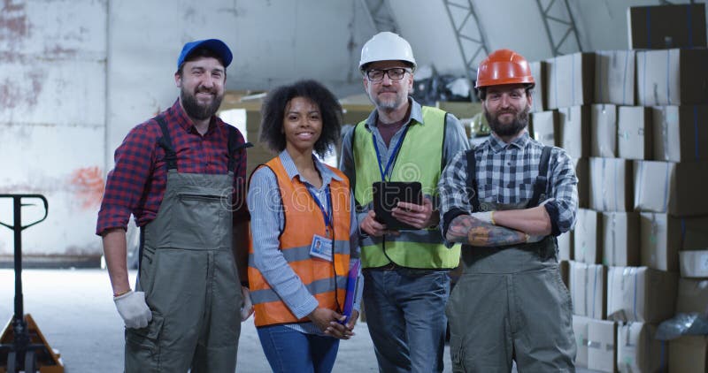 Happy staff posing in a warehouse stock photo Happy staff posing in a warehouse stock photo