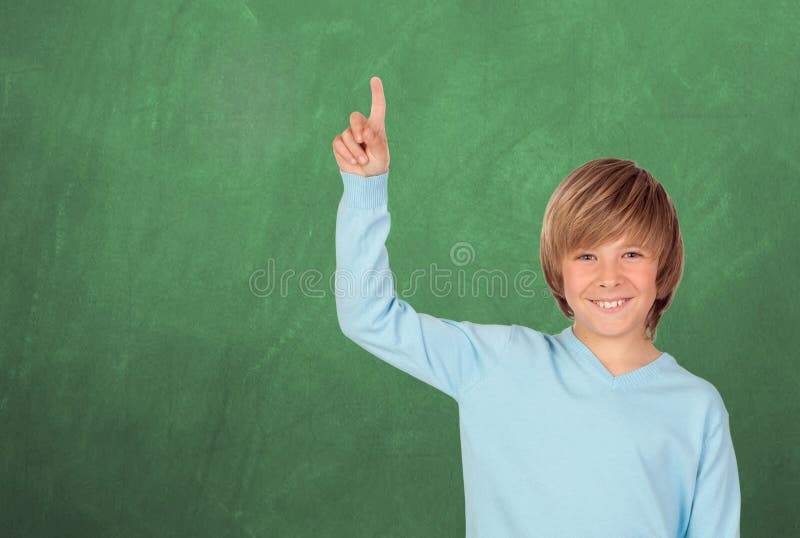 Happy student asking to speak with a green blackboard of background. Smiling asking stock images, royalty-free photos and pictures