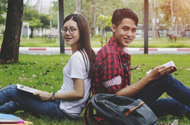 Happy Students Couple Sitting Together at University Stock Photo ...
