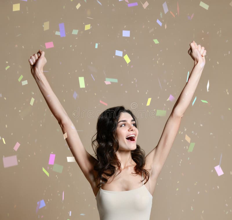 Happy successful young woman with raised hands shouting and celebrating success royalty free stock photos Happy successful young woman with raised hands shouting and celebrating success royalty free stock photos