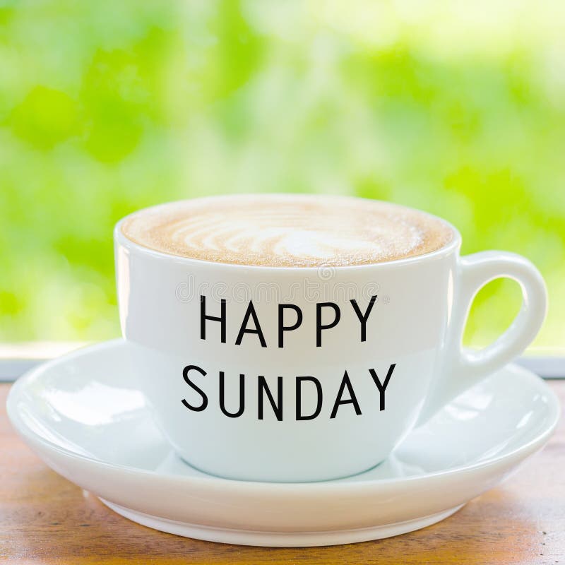 Happy Sunday on coffee cup. 