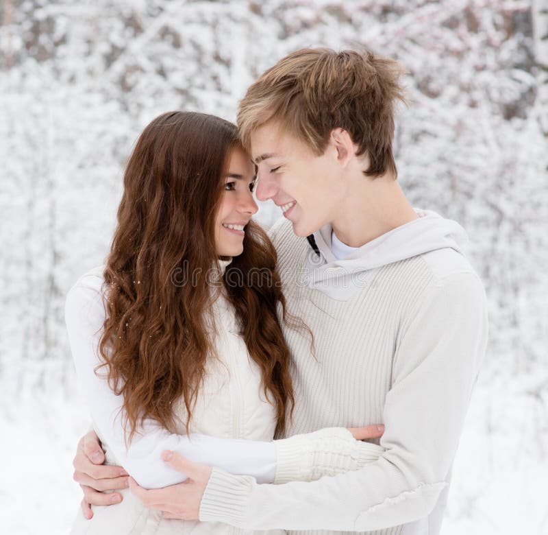 Happy sweethearts looking at one another stock photos